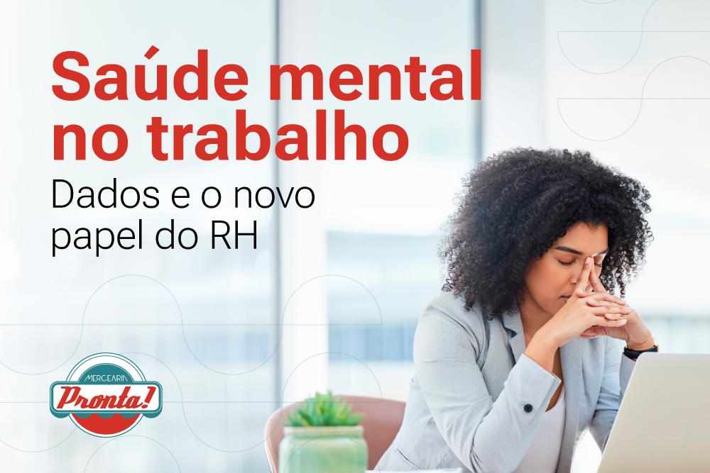 A mulher aparenta estar preocupada, representando o impacto da saúde mental no trabalho e a importância do bem-estar emocional no ambiente profissional.
